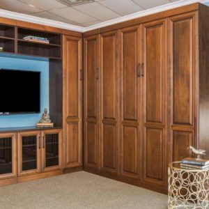 Custom entertainment center in dark oak finish with four hidden drawers.