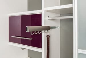Modern silver metal hooks for multi-purpose storage inside custom white wood closet cabinetry