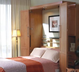 Professionally installed full size Murphy bed in medium wood