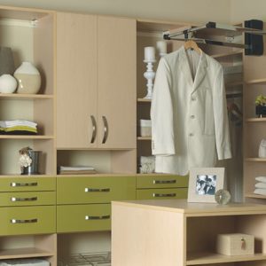 Custom closet design with drawers, rotating mirror, and wardrobe lift