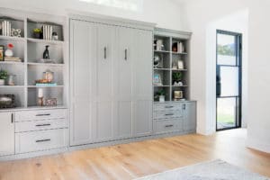 Hybrid room with grey custom cabinets for Murphy bed closed