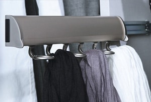Sliding scarf rack in a closet system.