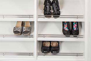 Shoe fences in custom closets help you see everything you own in one space.