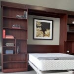 dark oak Murphy bed with a book case on then left side