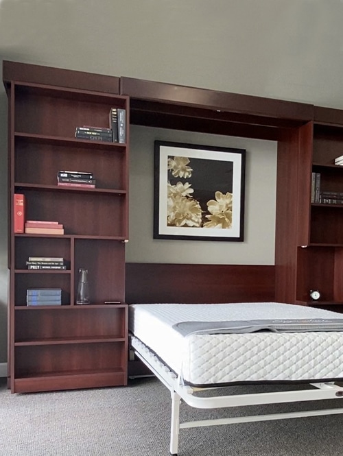 dark oak Murphy bed with a book case on then left side