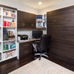 desk and the corner with decor and bed that is stored away
