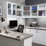 white cabinets, grey counter top, and fully stocked draws