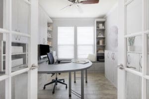 White minimalist home office through french doors