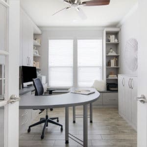 White minimalist home office through french doors