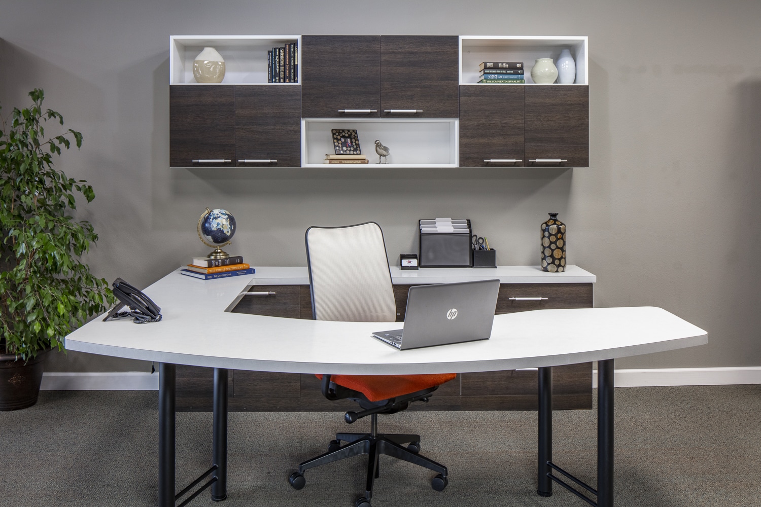 Modern wrap-around desk with mounted wall shelf storage