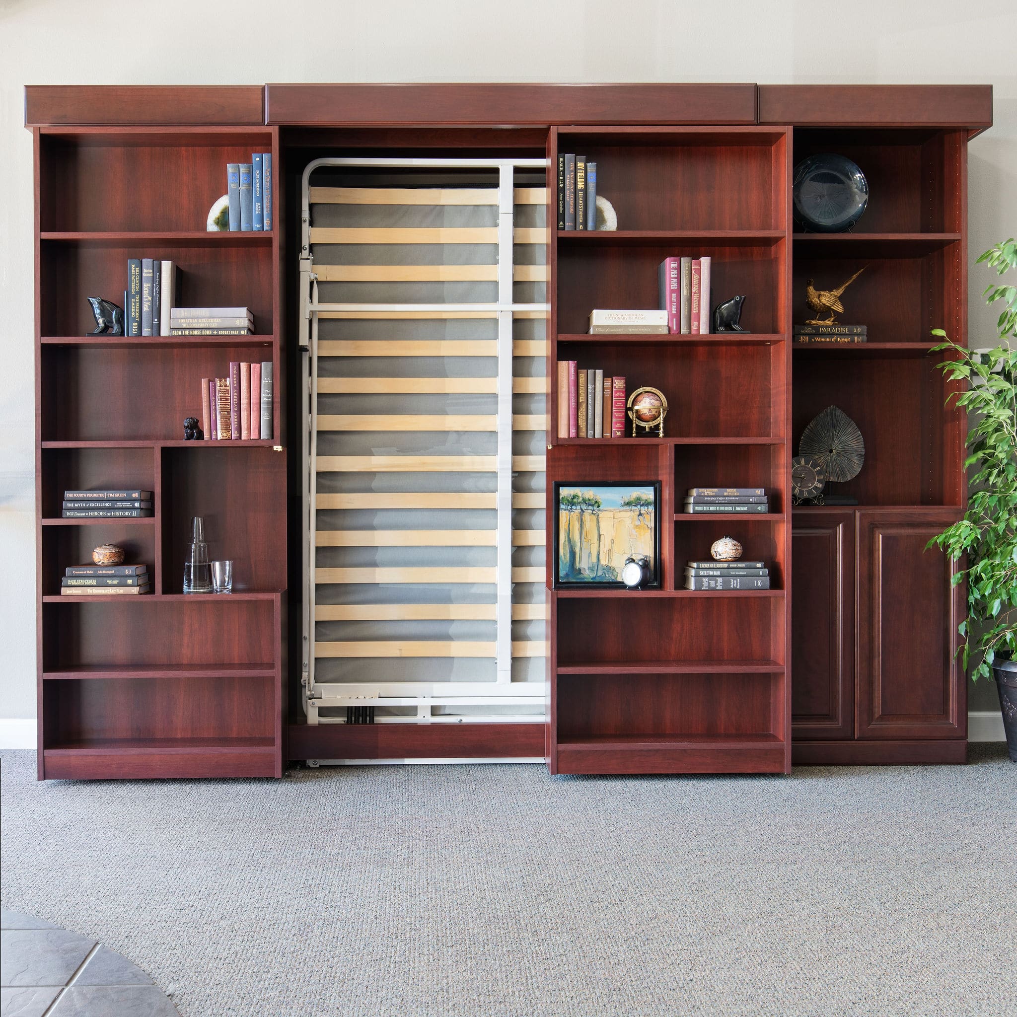 The Jefferson Murphy bed, with gliding doors, includes side cabinets for ample storage. Learn more about More Space Place Murphy bed custom solutions.