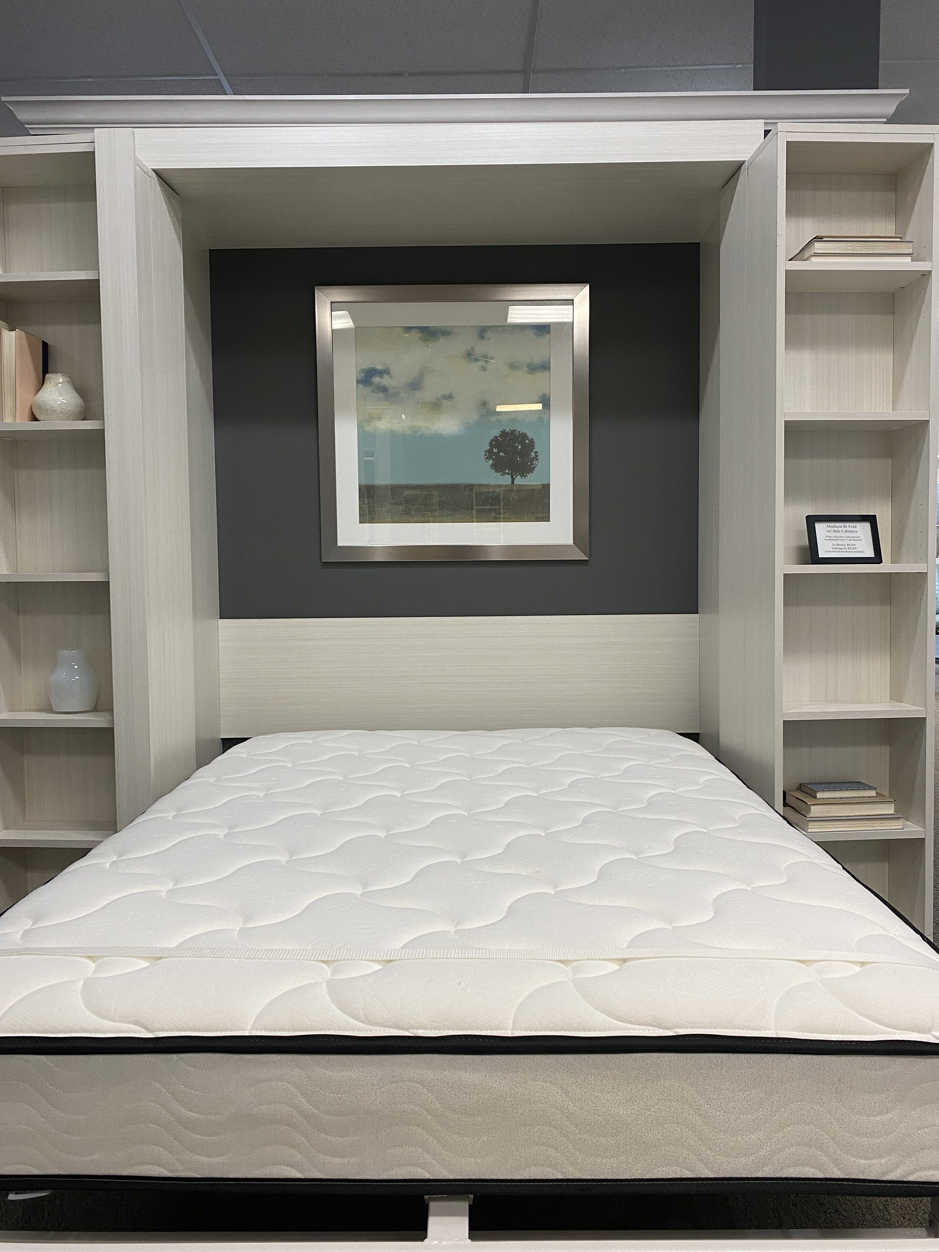 White cabinet Murphy bed with inner spring mattress is the perfect depth to fill the structure.