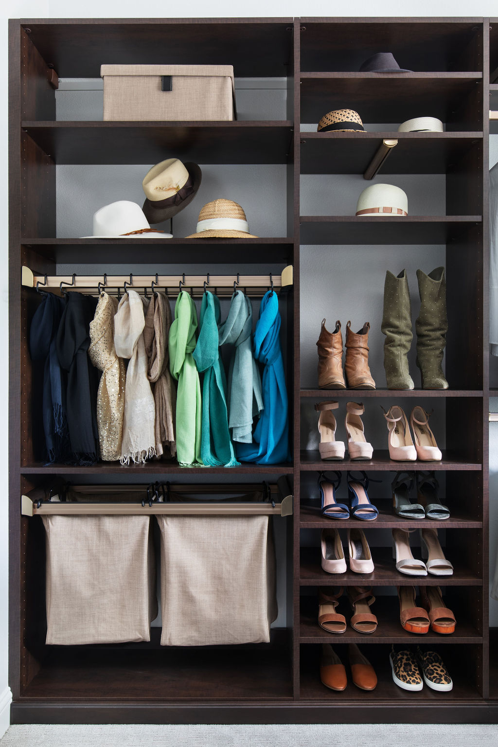 More Space Place custom-closet designers have specific training and experience to design solutions for your space, and they are familiar with what accessories are available to improve function. Iron away storage, wardrobe lifts, hampers, islands and benches are all functional additions to a custom closet. Talk with our closet designers today to learn more about our process.