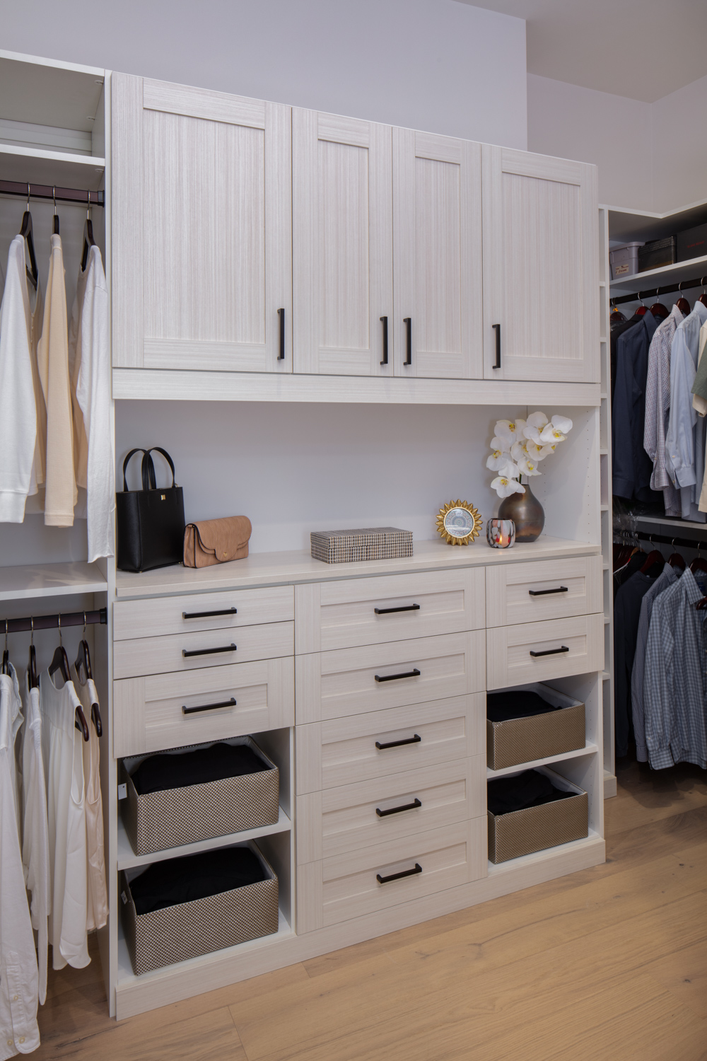 More Space Place custom-closet designers have specific training and experience to design solutions for your space, and they are familiar with what accessories are available to improve function. Iron away storage, wardrobe lifts, hampers, islands and benches are all functional additions to a custom closet. Talk with our closet designers today to learn more about our process.