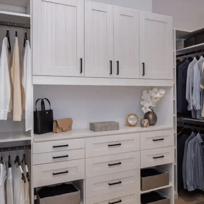 Walk-in closet in white chocolate 5-piece shaker with a pull-out ironing board.