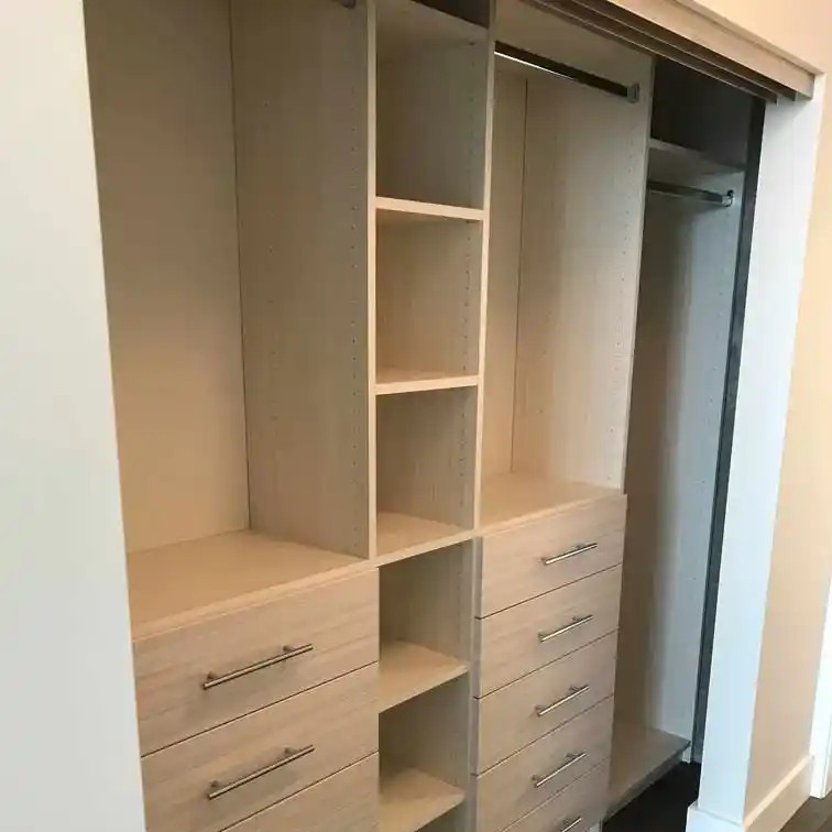 Reach in closet in white chocolate with drawers, shelves, and hanging.