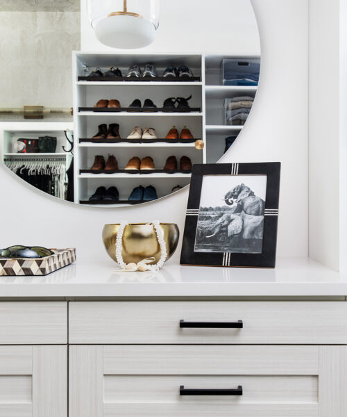 Vanity with custom mirror in a closet system.