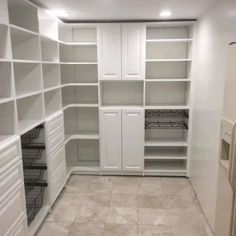 White traditional pantry with baskets and some closed storage.