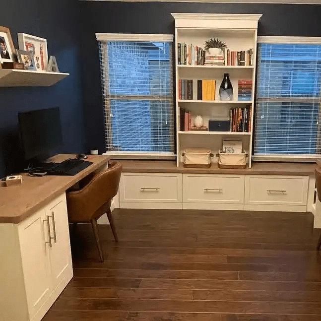 Home office in white shaker with a bench.