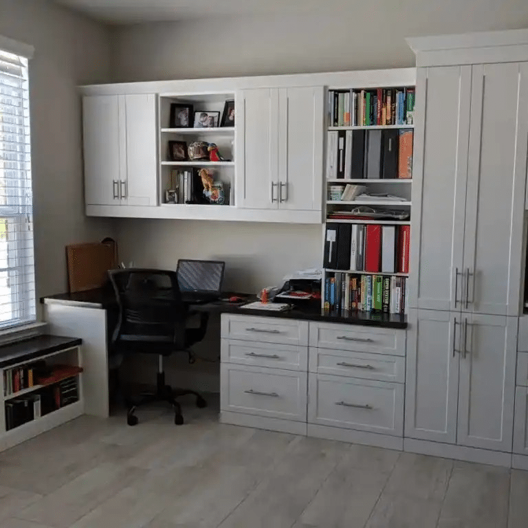 White shaker home office with lots of storage.