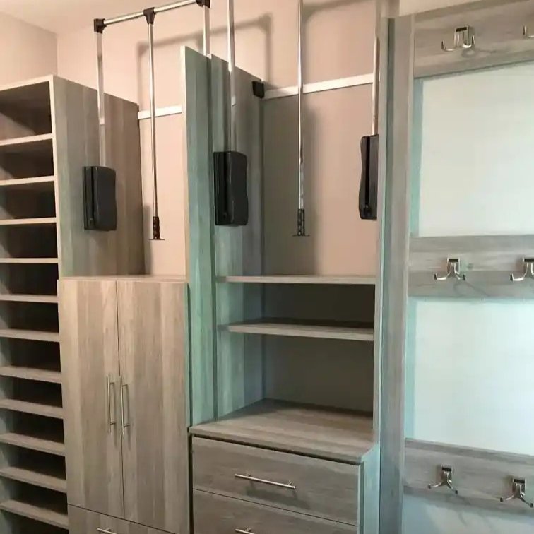 Summertime blues closet with wardrobe lifts and hooks.