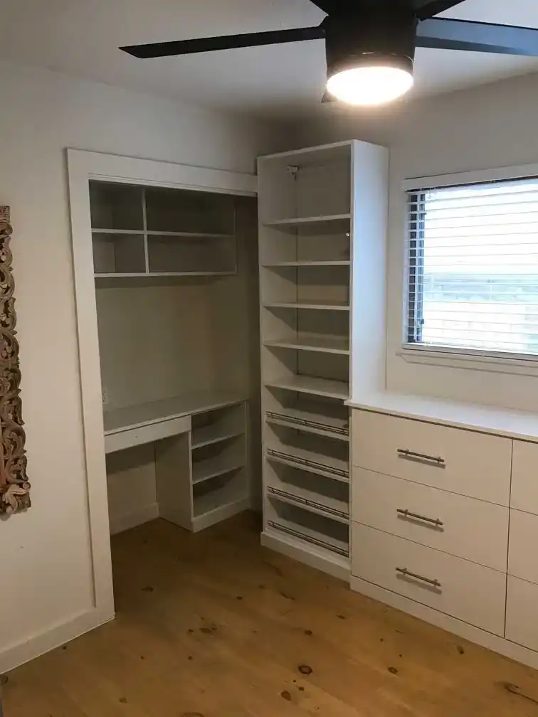 Guest room turned walk-in white contemporary closet.