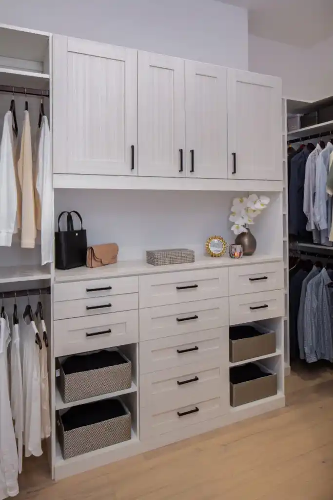 Walk-in closet in white chocolate 5-piece shaker with a pull-out ironing board.