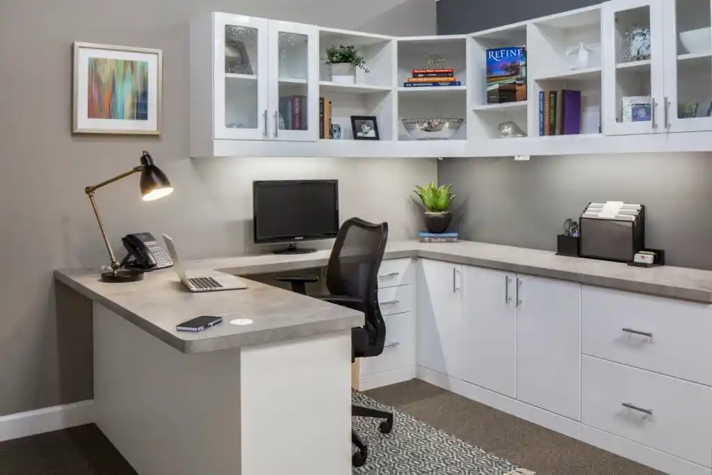 High gloss white home office with upper glass doors and open shelving.