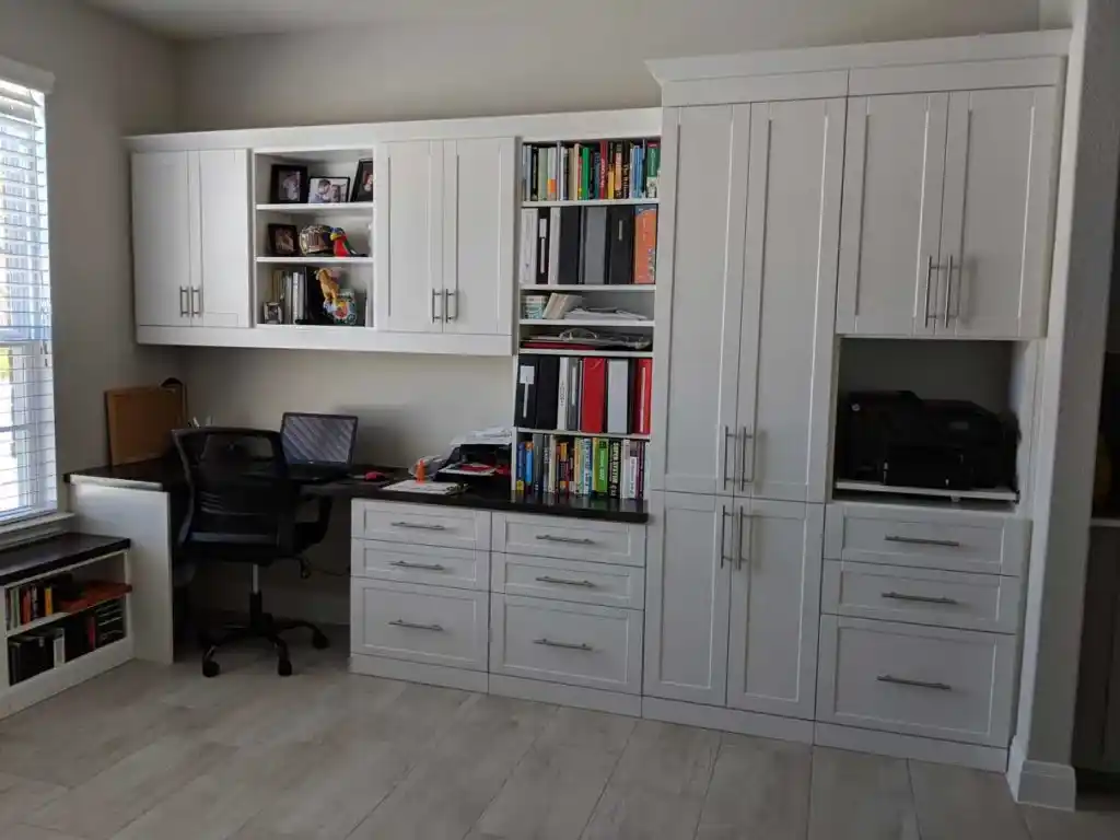 White shaker home office with lots of storage.